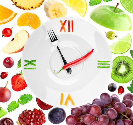 Food clock with fruit. Healthy food conceptの写真素材