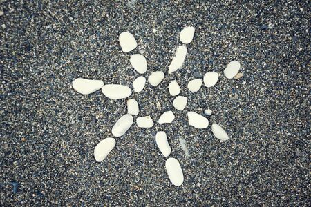 Sun symbol on the sandの写真素材