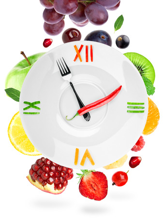 Food clock with fruit. Healthy food conceptの写真素材