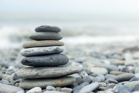 Stack of stones on a seashore. Concept of balance and harmonyの写真素材