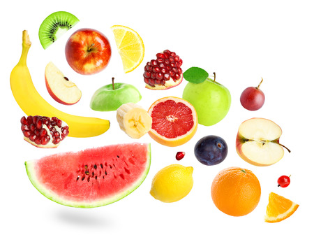 Falling color fruits and berries on white backgroundの写真素材