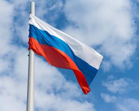 Russian flag on the blue skyの写真素材