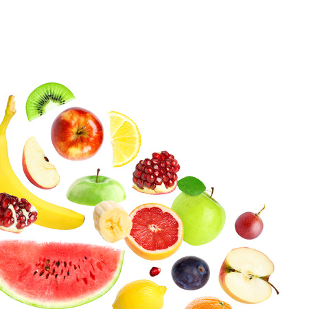 Falling fresh fruits and berries on white backgroundの写真素材