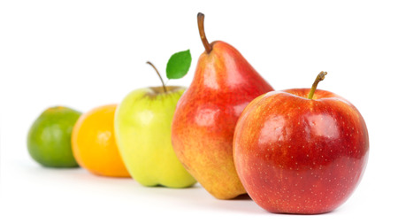 Fresh fruit. Apple, pear and orange closeup on white backgroundの写真素材