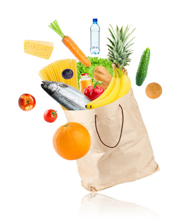Grocery bag with healthy food on white backgroundの写真素材