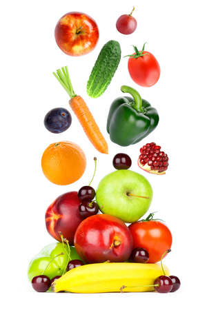 Fresh fruits and vegetables falling on white backgroundの写真素材