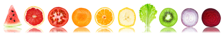 Collection of fresh fruit and vegetable slices on white backgroundの写真素材