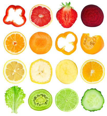 Collection of fresh fruit and vegetable slices on white backgroundの写真素材
