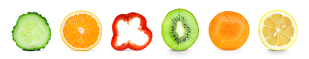 Collection of fresh fruit and vegetable slices on white backgroundの写真素材
