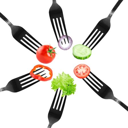 Vegetable on fork on white background. Fresh foodの写真素材