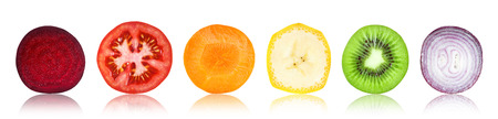 Slices of fruit and vegetable on white backgroundの写真素材