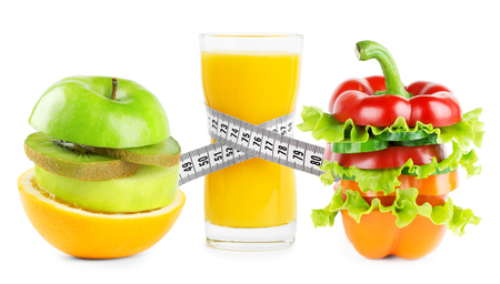 Juice with fruits and vegetables on white background. Diet conceptの写真素材
