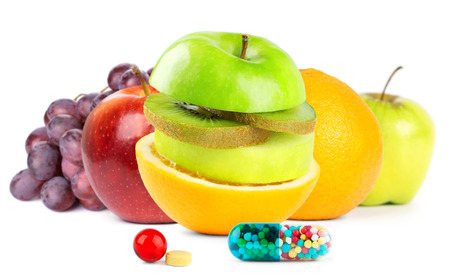 Fresh fruits with vitamins on white backgroundの写真素材
