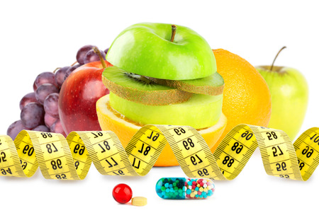 Fresh fruits with vitamins on white background. Dietの写真素材