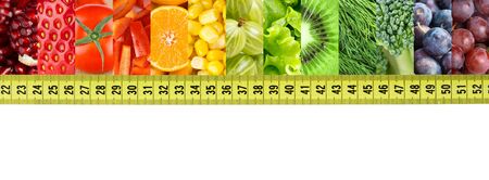 Fresh fruit and vegetable with measuring tape. Diet conceptの写真素材
