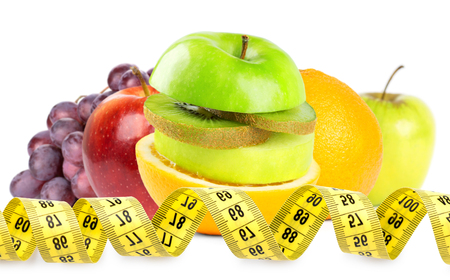 Fresh fruits with measuring tapeの写真素材
