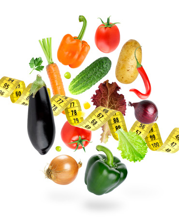 Falling fresh vegetables on white background. Diet. Fresh foodの写真素材
