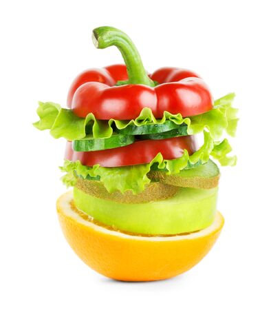 Stack of mixed fruit and vegetable slices on white background. Food concept. Fresh foodの写真素材