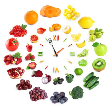 Food clock with fruits and vegetables. Healthy food conceptの写真素材