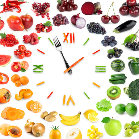Food clock with collection of fruits and vegetables. Healthy foodの写真素材