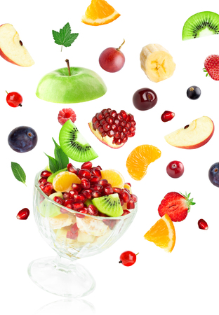 Fresh mixed fruits falling on white background. Fruit salad. Food conceptの写真素材