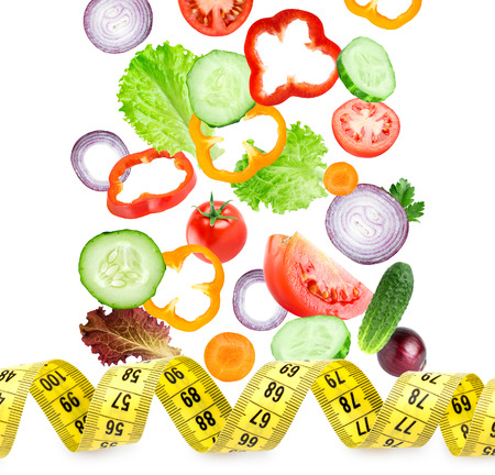 Falling of vegetables on white background. Diet conceptの写真素材