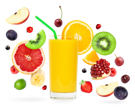 Fresh mixed fruits falling and orange juice on white background. Food conceptの写真素材