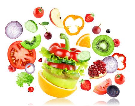 Fresh mixed fruits and vegetables falling on white background. Food conceptの写真素材