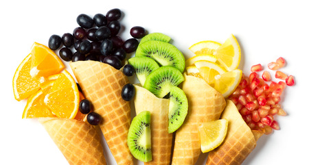 Fresh mixed fruits in cones.の写真素材