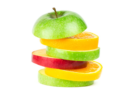Stack of mixed fruit slices on whiteの写真素材