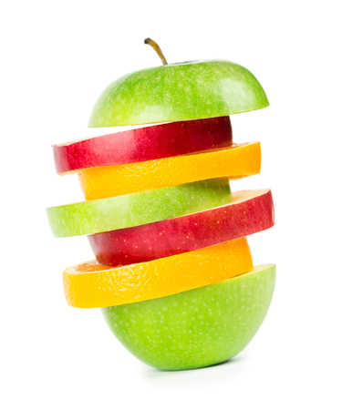 Fruit slices. Stack of mixed fruit on whiteの写真素材