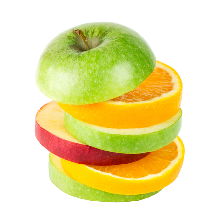 Fresh fruits. Stack of apple and orange slices isolated on white backgroundの写真素材