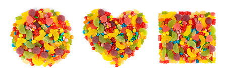 Mixed colorful candies. Collection of heart, circle and square of color sweets on whiteの写真素材