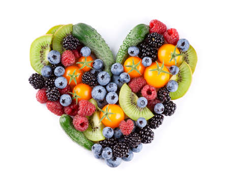 Fruits and vegetables. Heart of mixed fruits, berries and vegetables on white background. Fresh food. Top view.の写真素材