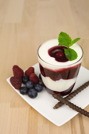 Dessert of creamy  yoghurt with layers of cherry jelly.の写真素材