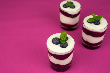 Dessert of creamy  yogurt with layers of cherry jelly.の写真素材