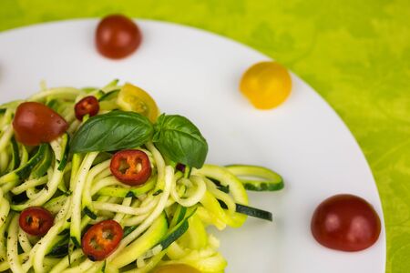 vegetarian zucchini noodles with cherry tomatoes and pepperの写真素材