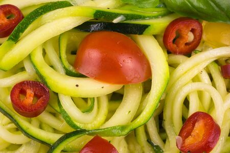 vegetarian zucchini noodles with cherry tomatoes and pepperの写真素材