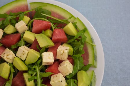 salad of watermelon with avocado and feta with rocketの写真素材