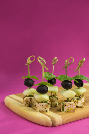 skewers of marinated feta with fennel and sesame seedsの写真素材