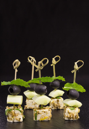 skewers of marinated feta with fennel and sesame seedsの写真素材