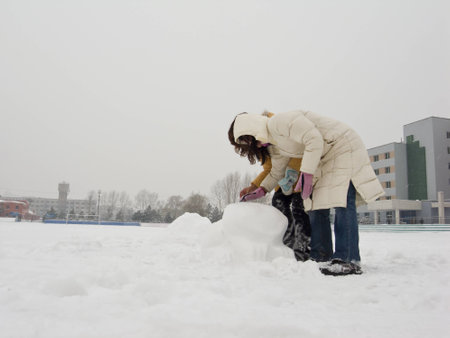 Girls are  playing the snowの写真素材