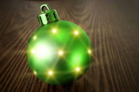 Christmas green ball on a wooden backgroundの写真素材