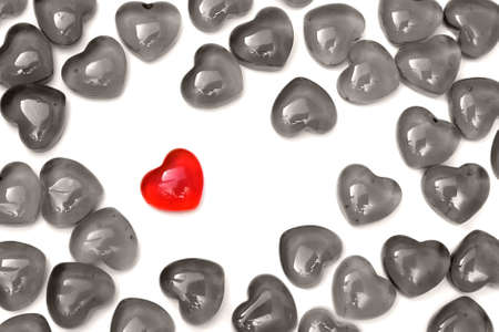 Bright red heart on a white background among others heartsの写真素材