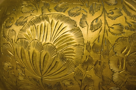 Stamping floral pattern on a metal vaseの写真素材