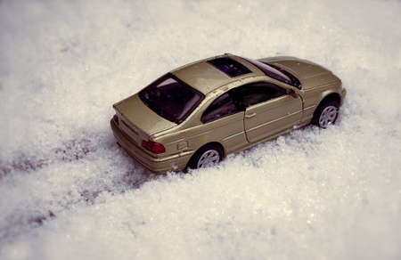 Toy Car riding through snow
