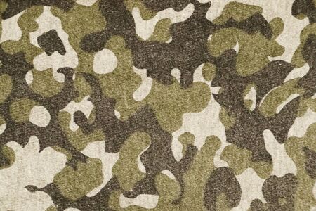 Vintage military background. Fabric with green retro camouflage pattern.の写真素材