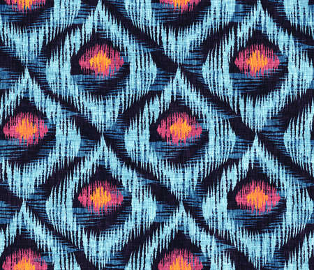 Vintage  seamless pattern in ikat style. Retro ikat blue pattern with abstract peacock feathers.の写真素材