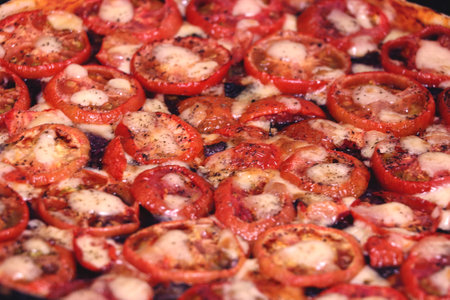 Pizza with tomatoes in macro style.の写真素材