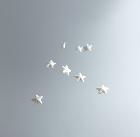 Creative winter scene with white stars. Sunny day concept. Minimal top view.の写真素材
